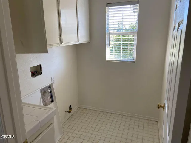 a bathroom with a sink and a window