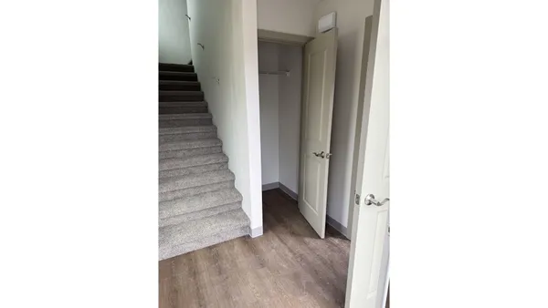 a view of a hallway with stairs