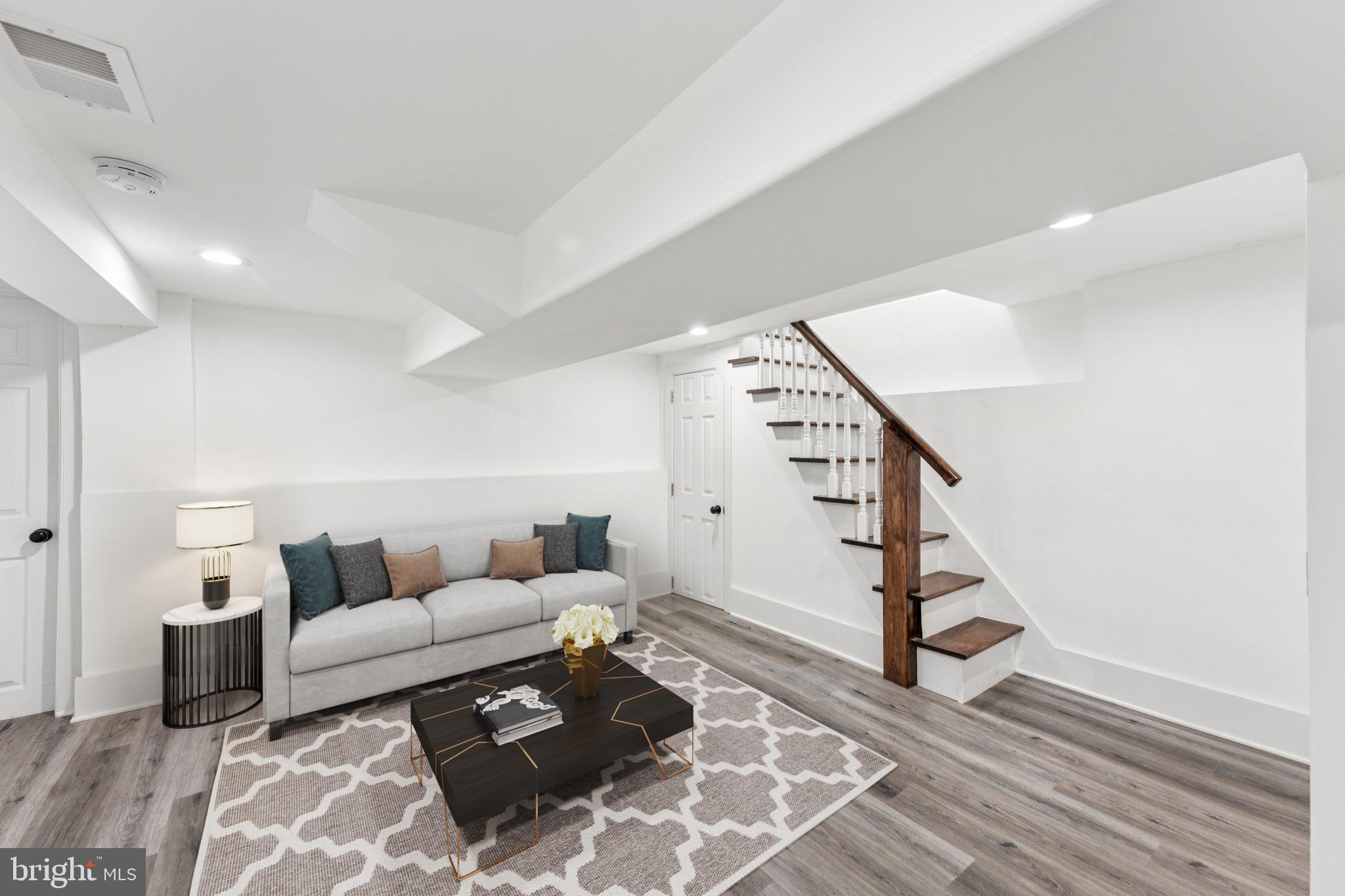 2105 4th Street Northeast Washington, DC 20002 - Photo 25 of 30 a living room with furniture and stairs