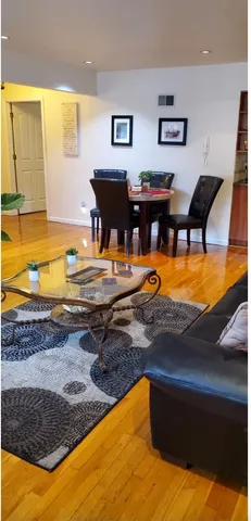 a view of a swimming pool with an outdoor seating