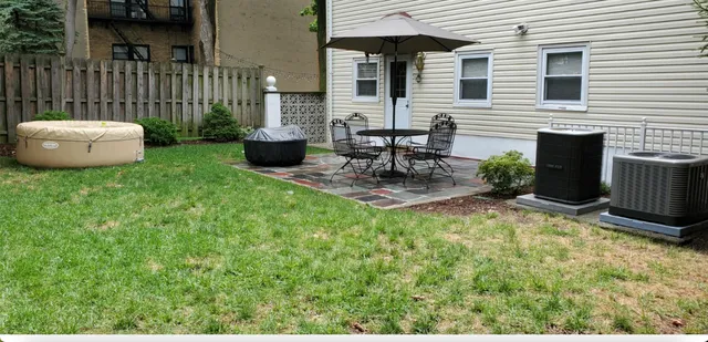 a backyard of a house with seating space