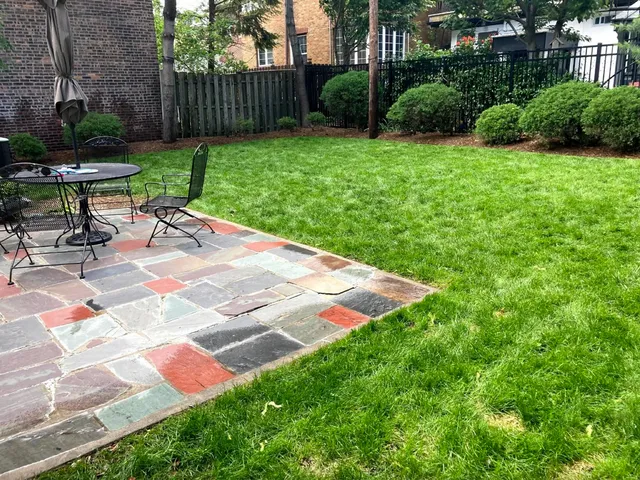 a view of a backyard with sitting area