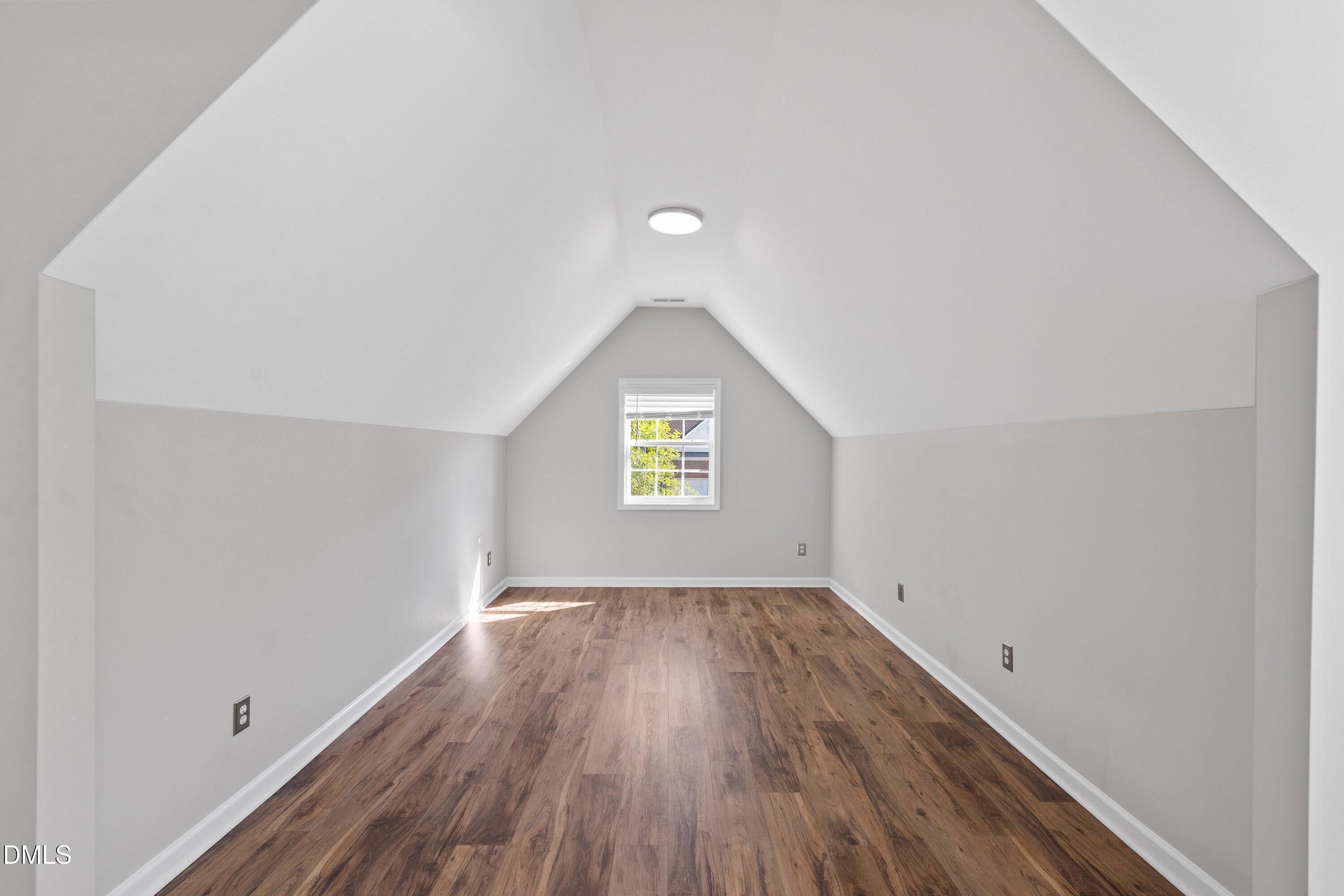 3717 Windmeade Road Wake Forest, NC 27587 - Photo 29 of 51 an empty room with wooden floor and windows