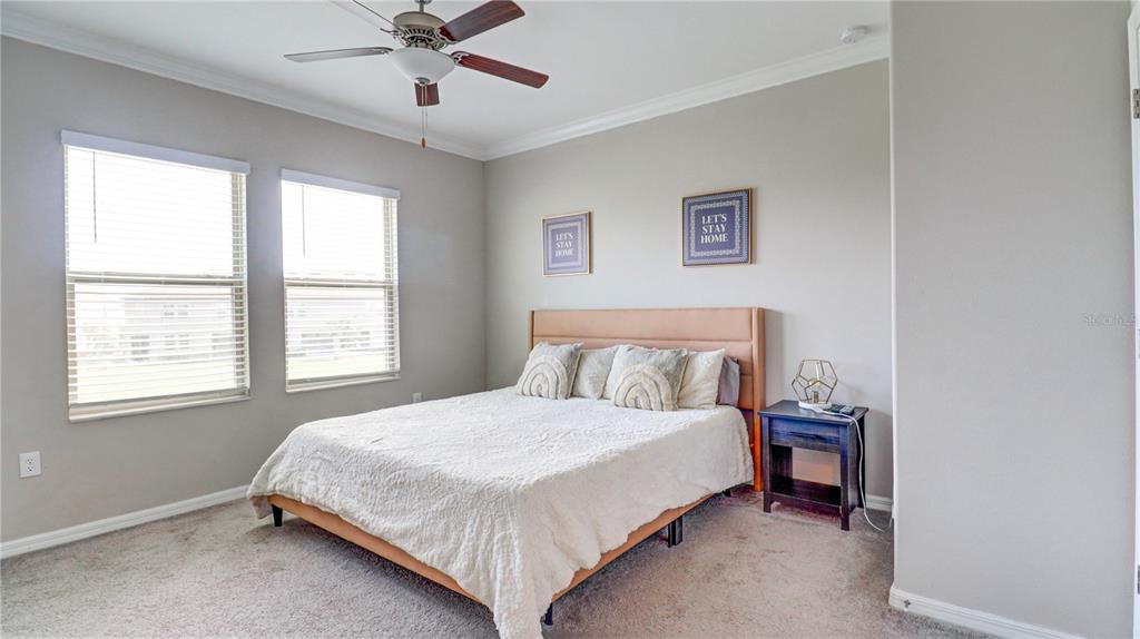 31632 Blue Passing Loop Wesley Chapel, FL 33545 - Photo 25 of 48 a bedroom with a bed and a window