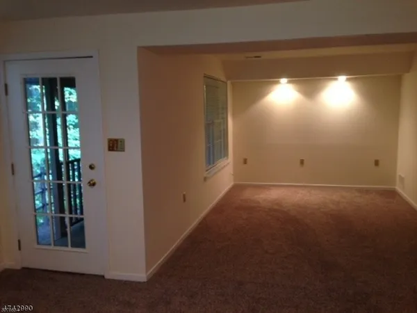 a view of a garden with wooden fence
