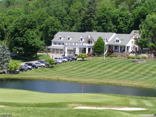 a view of a house with backyard porch and sitting area