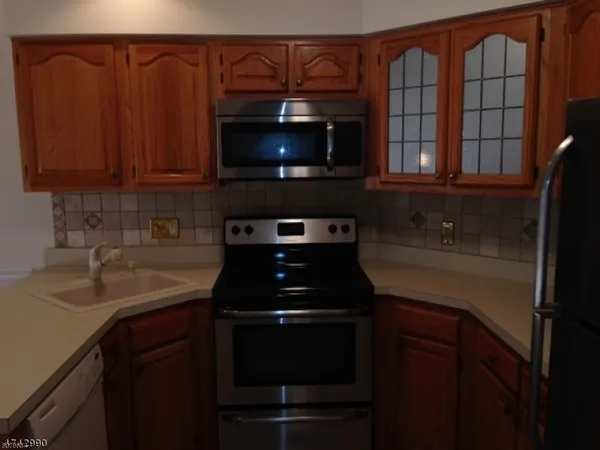 a kitchen with a sink and a microwave
