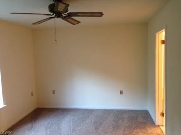 a view of a small space with a fan