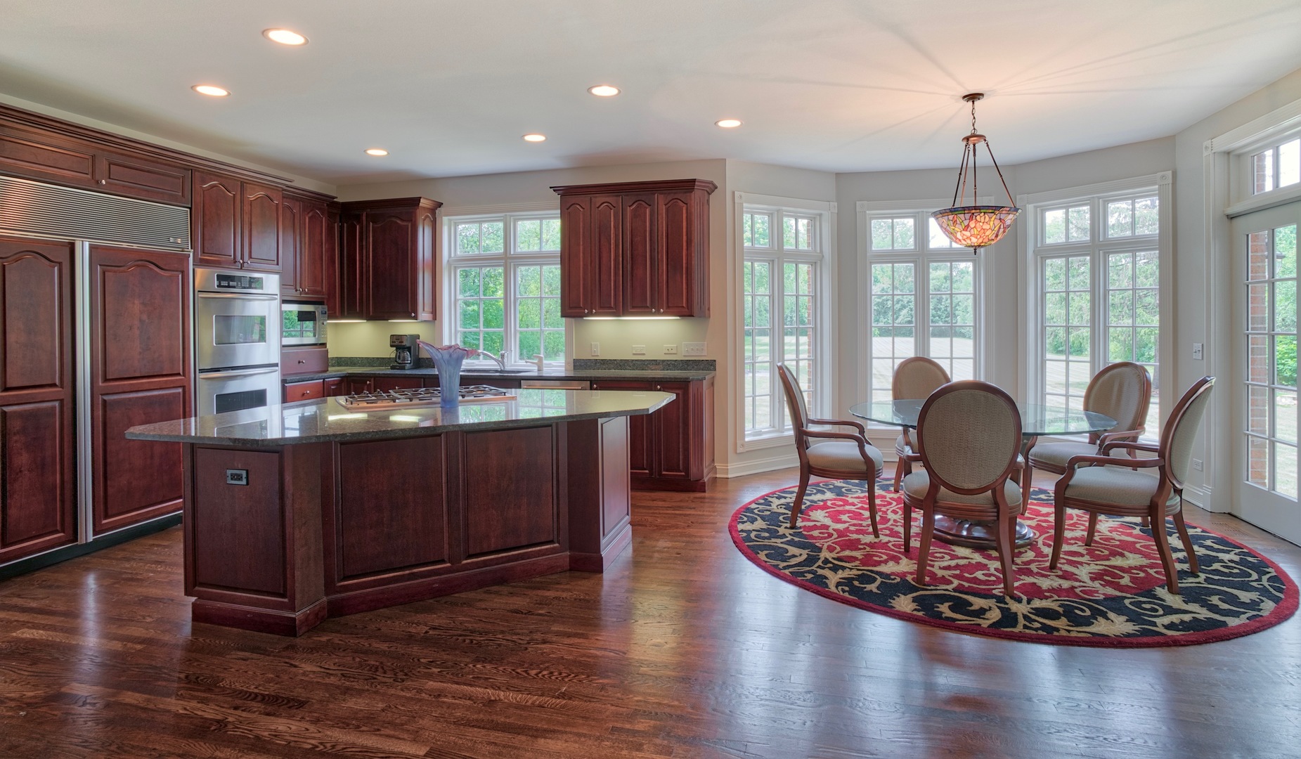 1830 Telegraph Road Lake Forest, IL 60045 - Photo 11 of 33 a kitchen with a dining table chairs and refrigerator