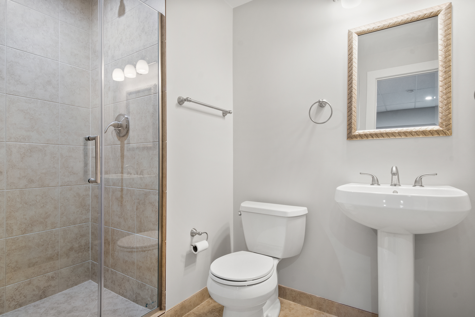 1830 Telegraph Road Lake Forest, IL 60045 - Photo 27 of 33 a bathroom with a toilet sink and mirror