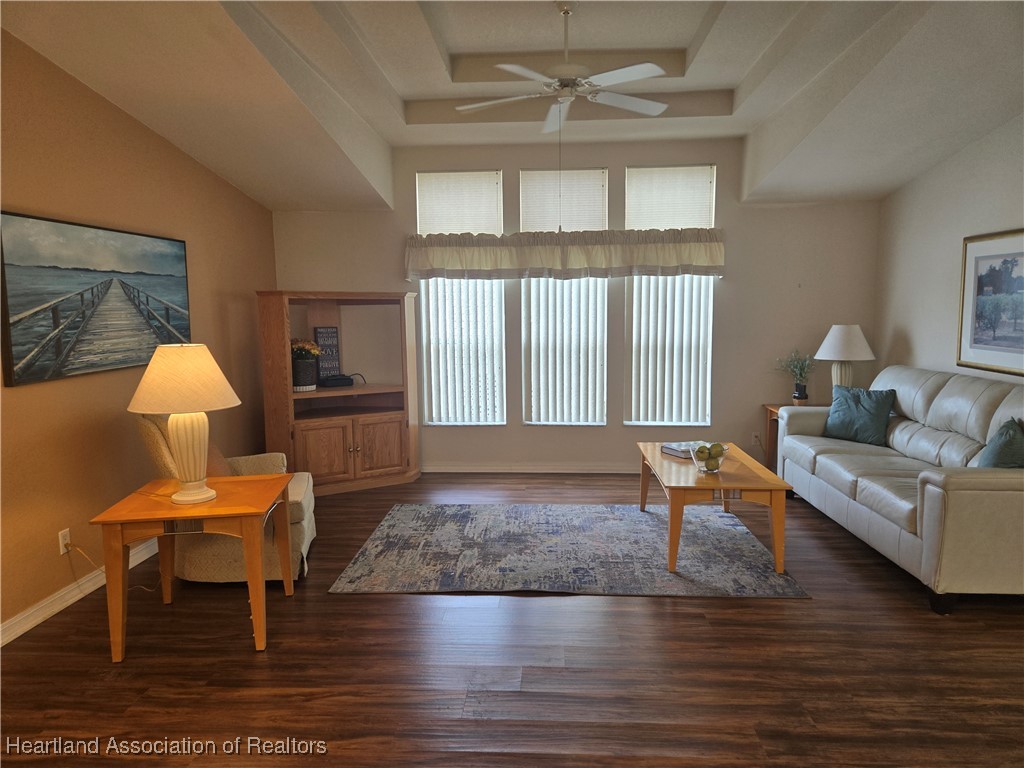 3312 Beartooth Pass Sebring, FL 33872 - Photo 9 of 39 a living room with furniture and a wooden floor