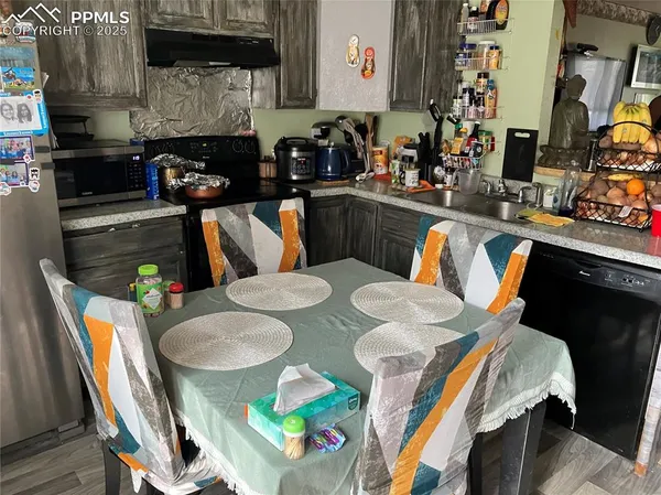 a dining room with furniture and wooden floor