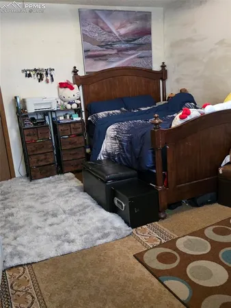 a bed room with a bed and a dresser