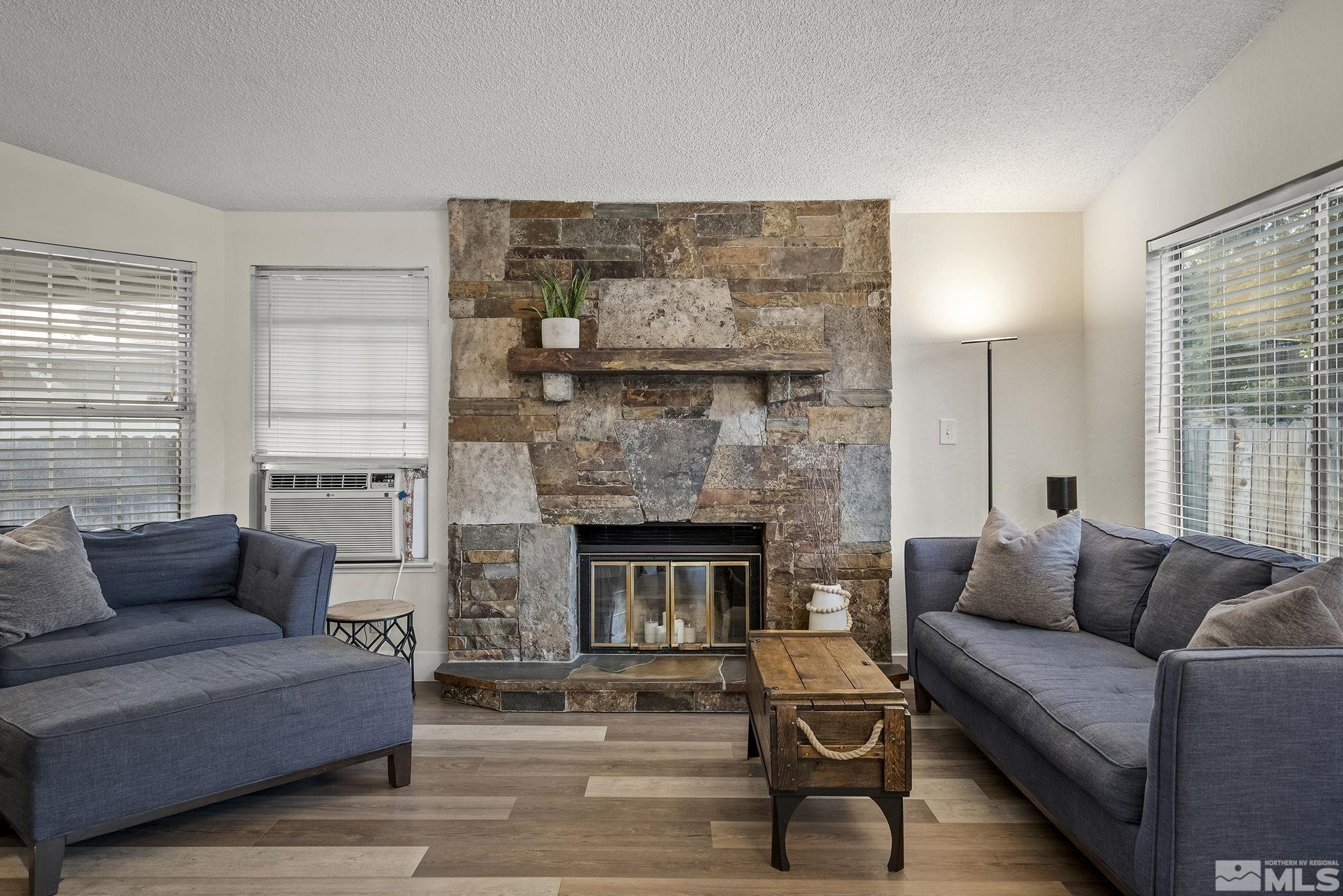 6036 Warm River Road Reno, NV 89523 - Photo 6 of 29 a living room with furniture and a fireplace