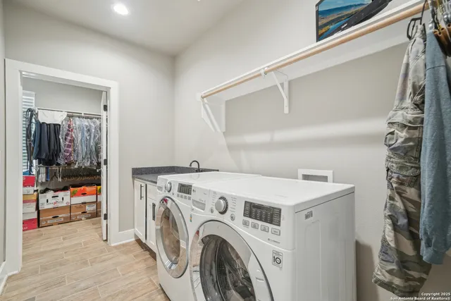 a bathroom with a sink a vanity and a mirror
