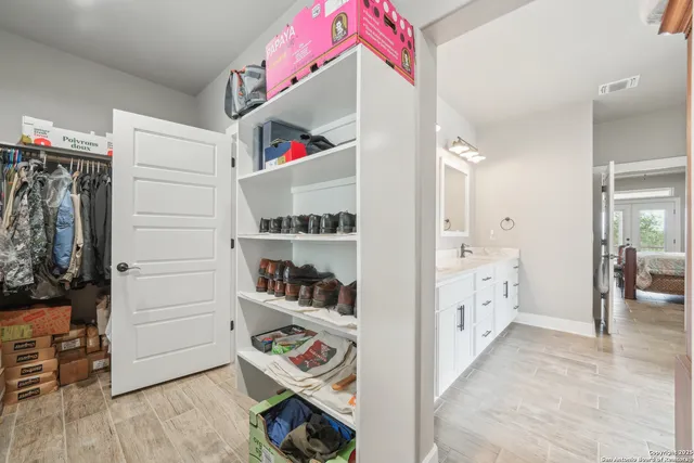 a bathroom with a double vanity sink mirror and