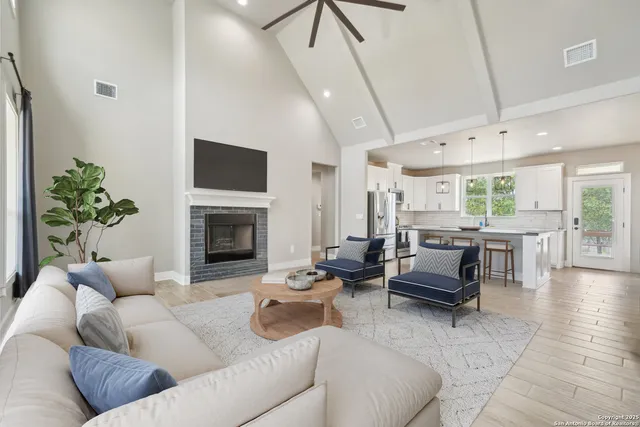 a living room with furniture and a fireplace