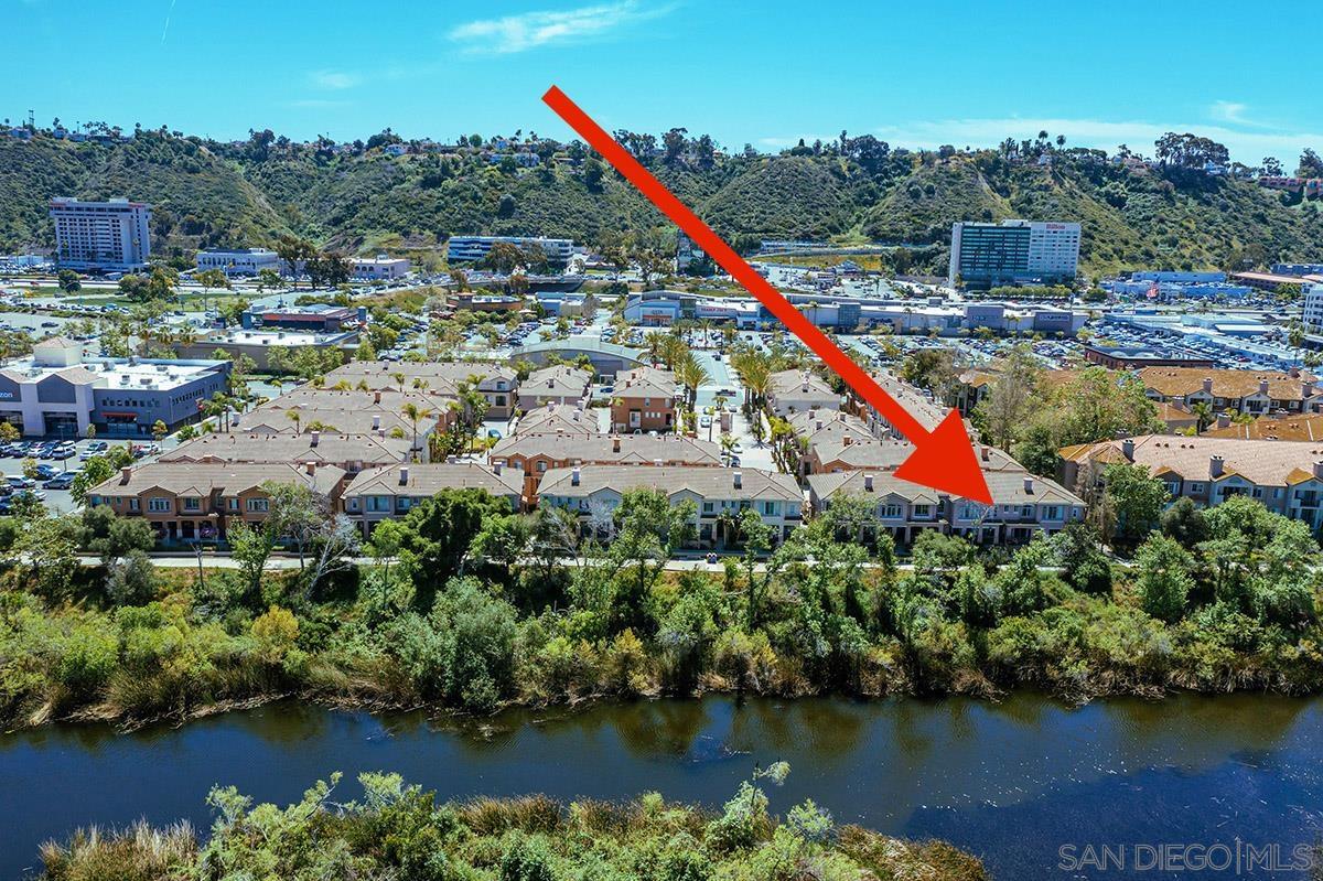 a view of a houses with swimming pool and a lake