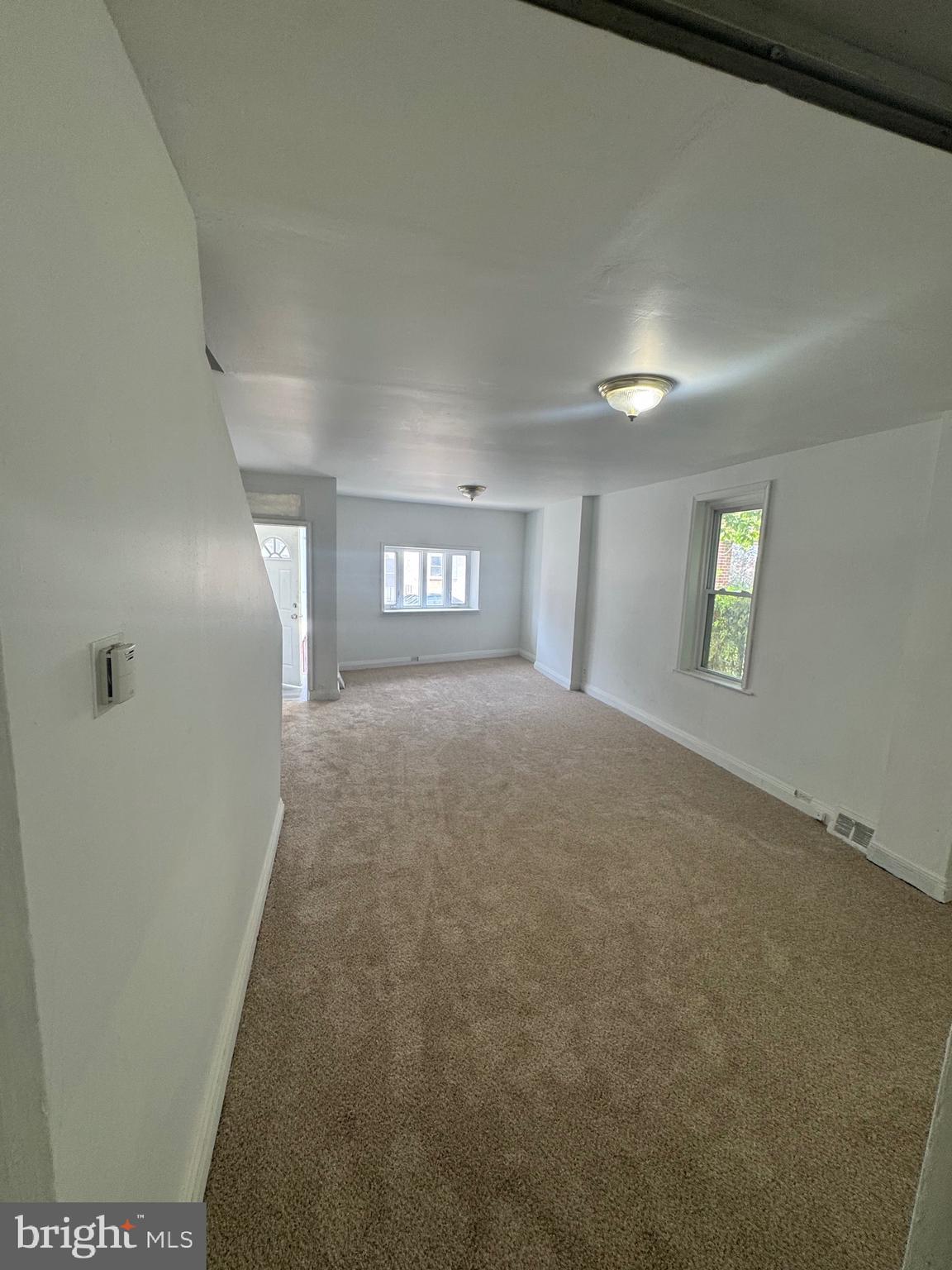 312 Concord Avenue Chester, PA 19013 - Photo 3 of 6 a view of an empty room and window