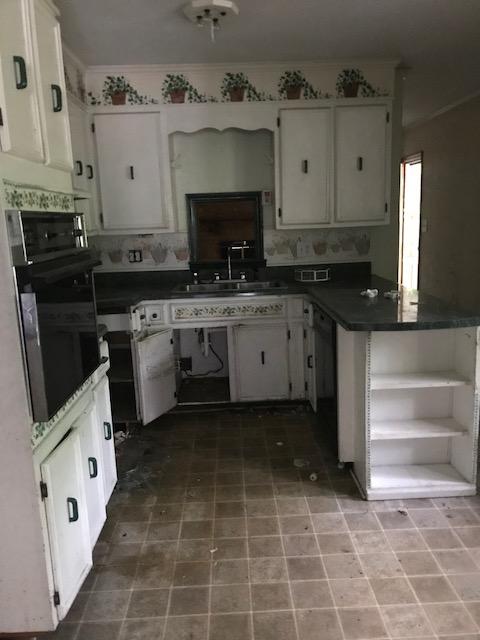 6105 North Fork Road Elliston, VA 24087 - Photo 2 of 12 a kitchen with stainless steel appliances a stove a sink and a refrigerator