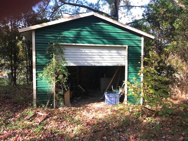 6105 North Fork Road Elliston, VA 24087 - Photo 10 of 12 a front view of a house with a yard and garage