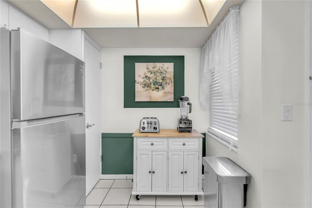 12200 Vonn Road, Unit 2206 Largo, FL 33774 - Photo 12 of 60 a bathroom with a sink a mirror and a shower