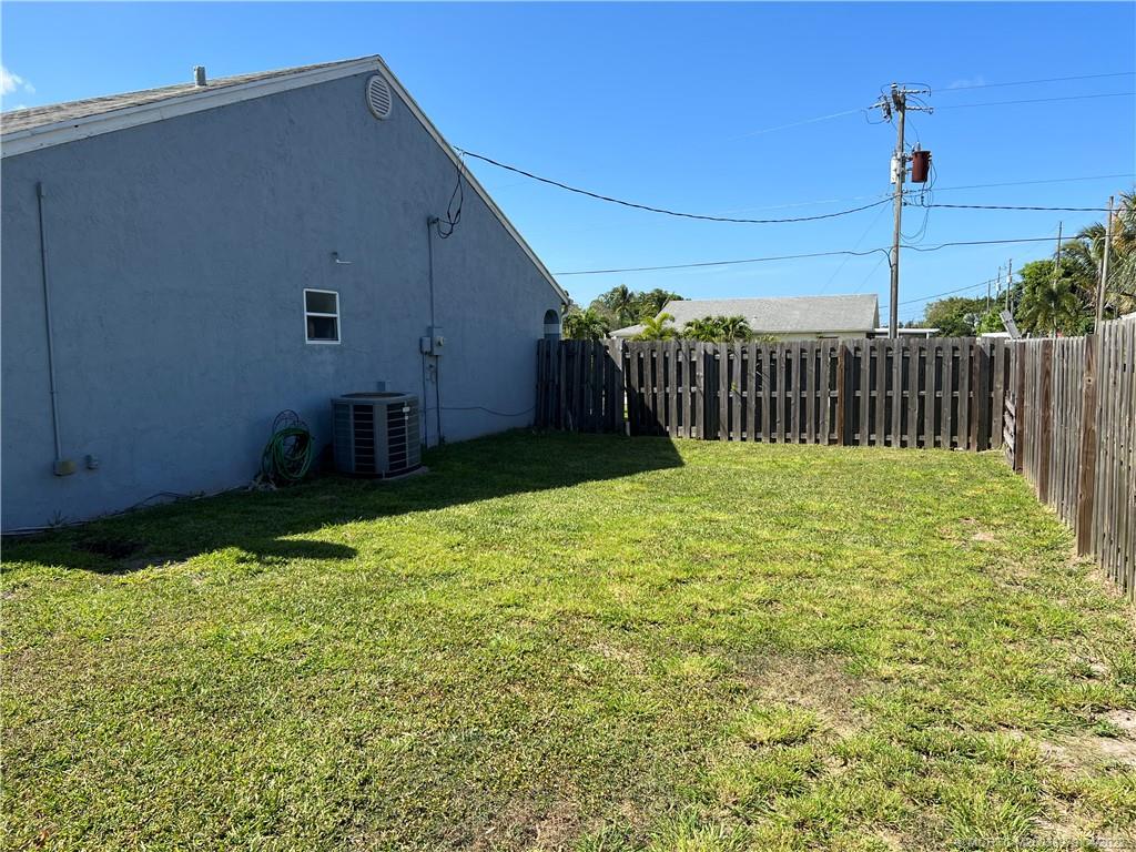 5140 Southeast Dell Street Stuart, FL 34997 - Photo 5 of 21 a view of backyard with pathway