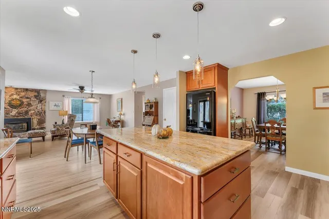an open kitchen with furniture and windows