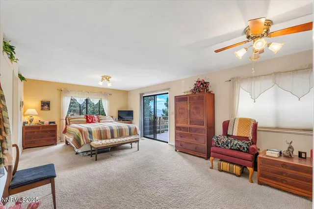 a bedroom with furniture and wooden floor