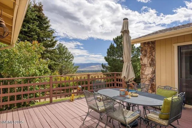 a view of balcony with furniture and wooden floor