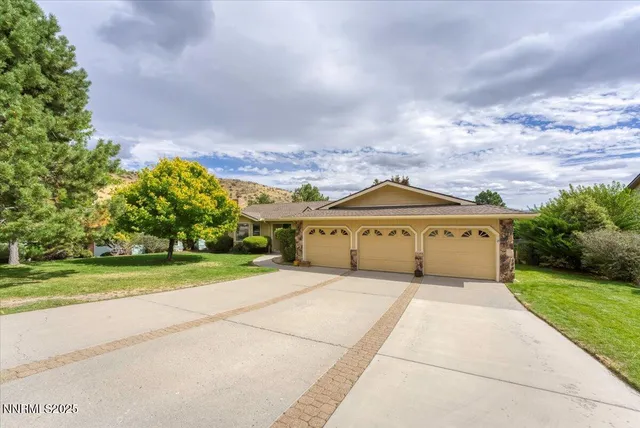 a view of house with yard and entertaining space