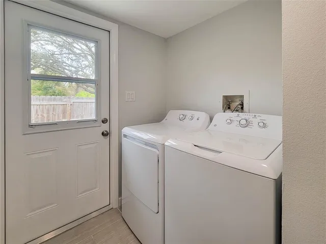 a utility room with dryer and washer