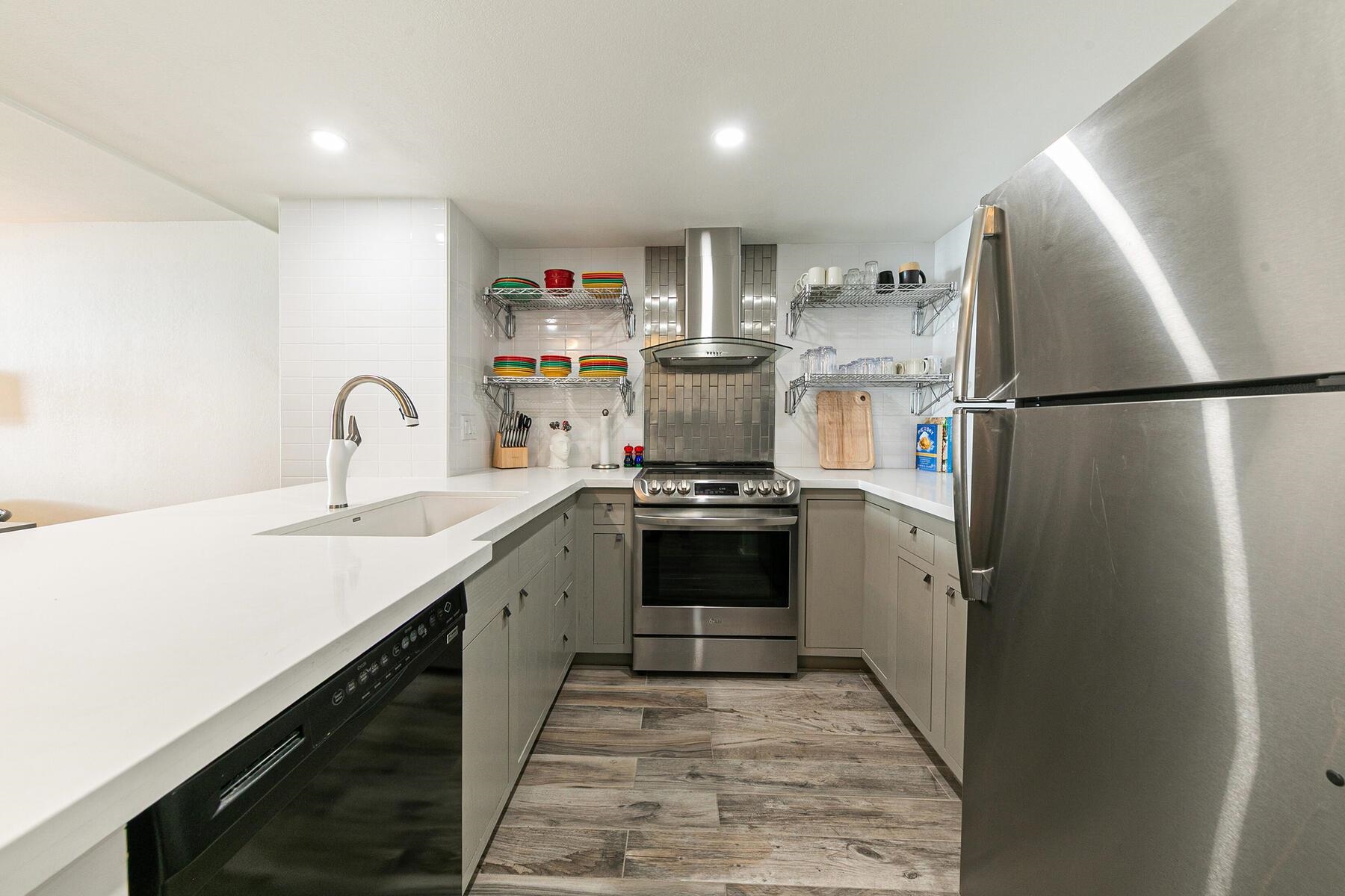 135 Alpine Meadows Road, Unit 15 Alpine Meadows, CA 96145 - Photo 11 of 28 a kitchen with refrigerator a sink and cabinets