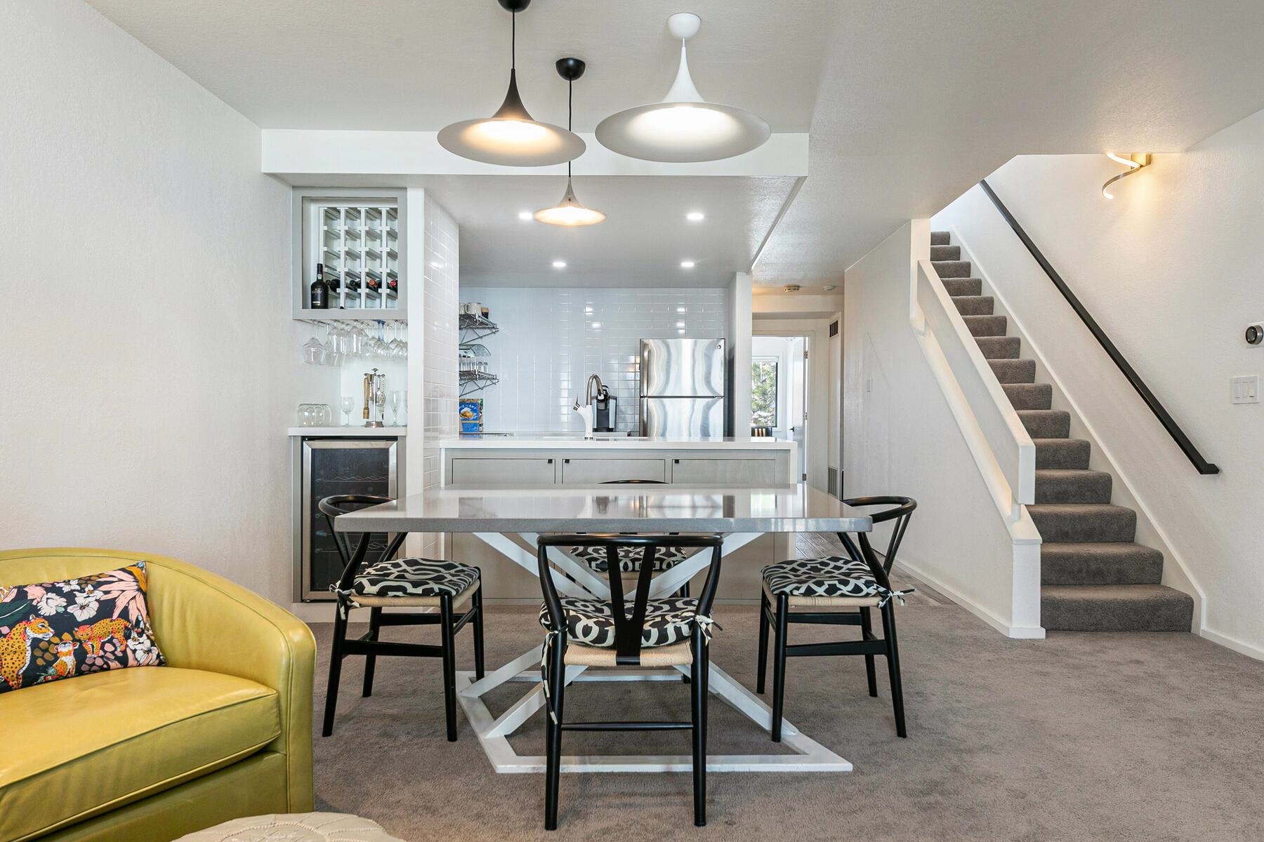 135 Alpine Meadows Road, Unit 15 Alpine Meadows, CA 96145 - Photo 13 of 28 a dining room with furniture and entryway