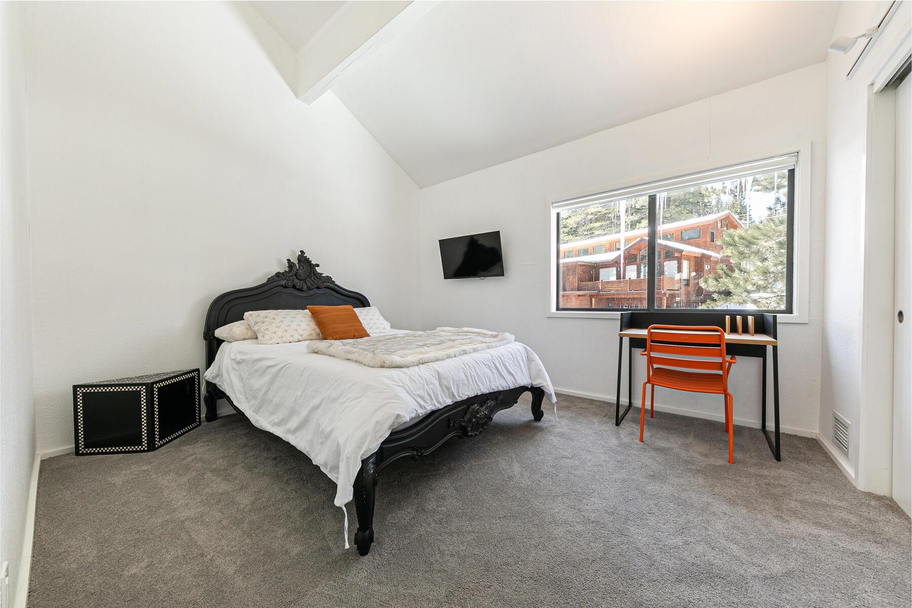 135 Alpine Meadows Road, Unit 15 Alpine Meadows, CA 96145 - Photo 15 of 28 a bedroom with a bed and a window