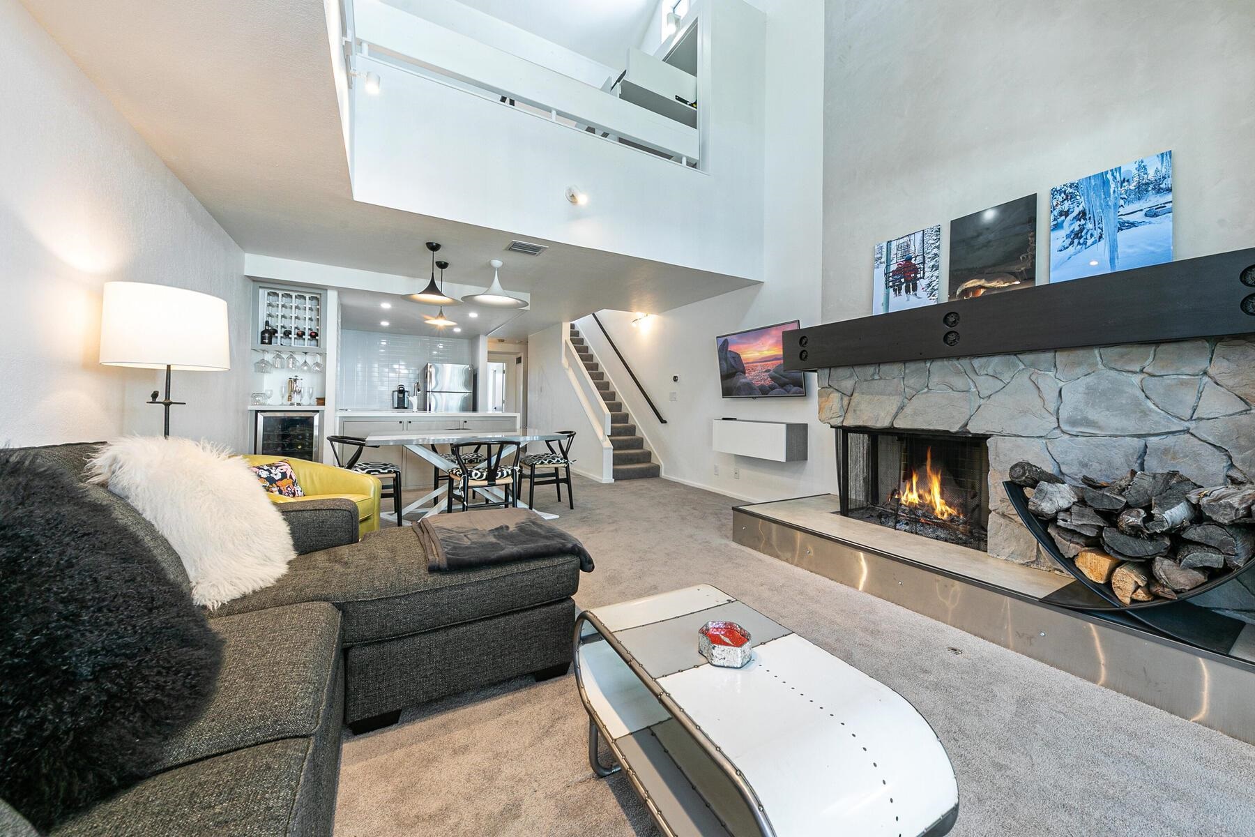 135 Alpine Meadows Road, Unit 15 Alpine Meadows, CA 96145 - Photo 7 of 28 a living room with furniture and a fireplace