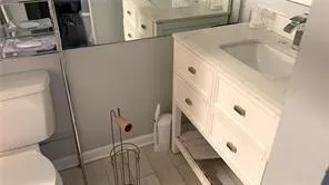a bathroom with a sink and toilet