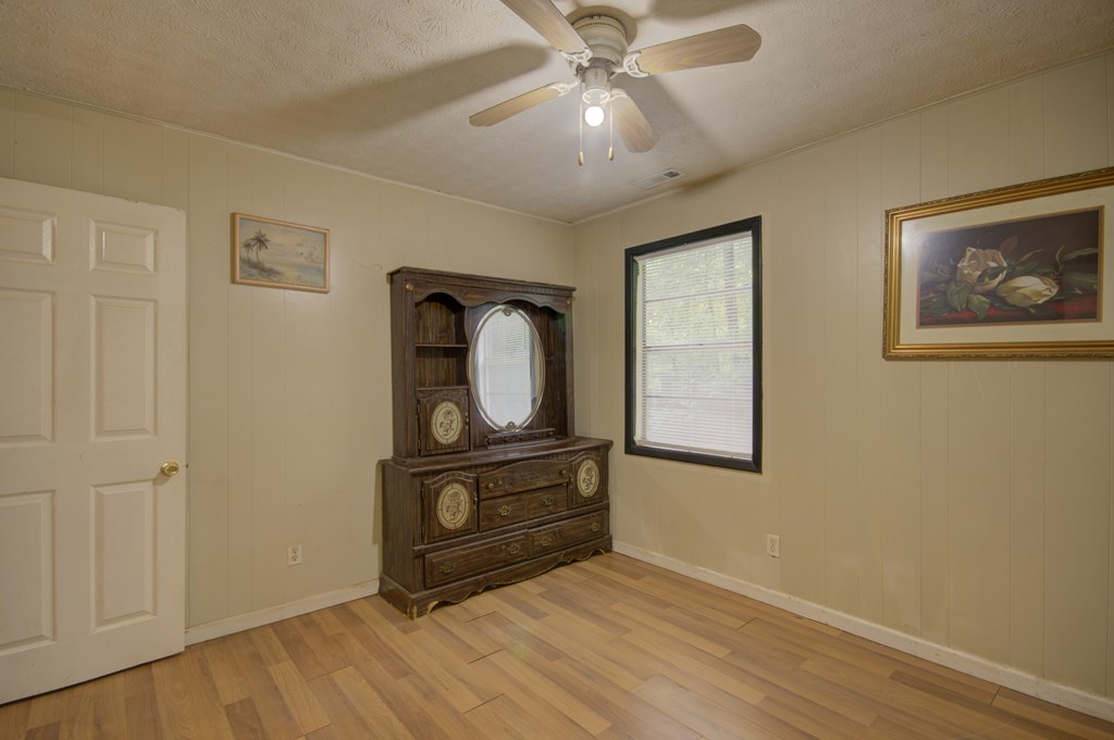 92 No-Where Road Blairsville, GA 30512 - Photo 12 of 36 a view of a hallway with wooden floor and workspace