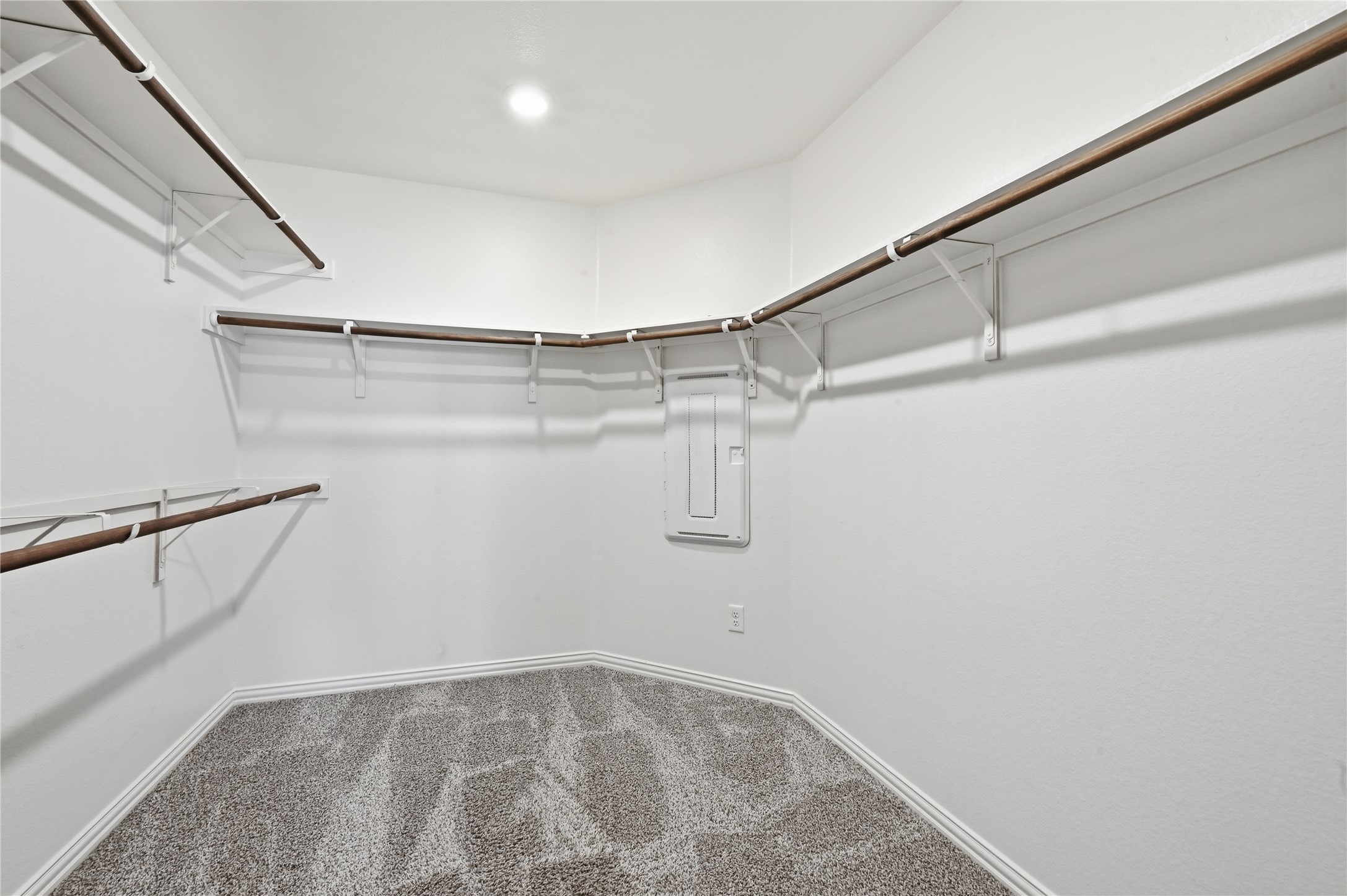 426 Cold Riv Run Kyle, TX 78640 - Photo 19 of 34 A well-organized walk-in closet featuring clean white walls and ample hanging space.
