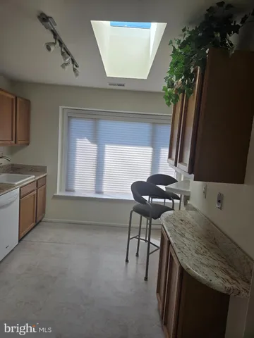a kitchen with furniture and a sink