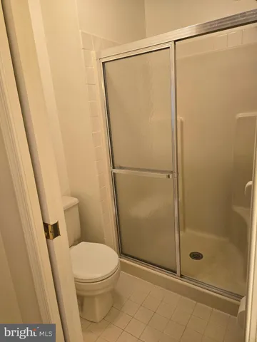 a bathroom with a shower and a toilet