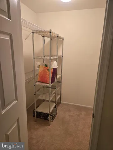 a room that has a bed and a chair in it