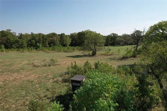 an aerial view of a town with trees