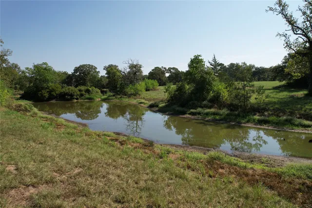 a view of a lake with houses in all around