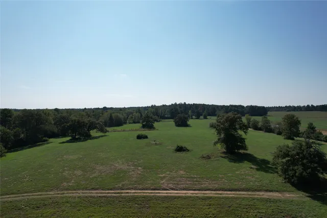 a view of a ocean with mountains in the background