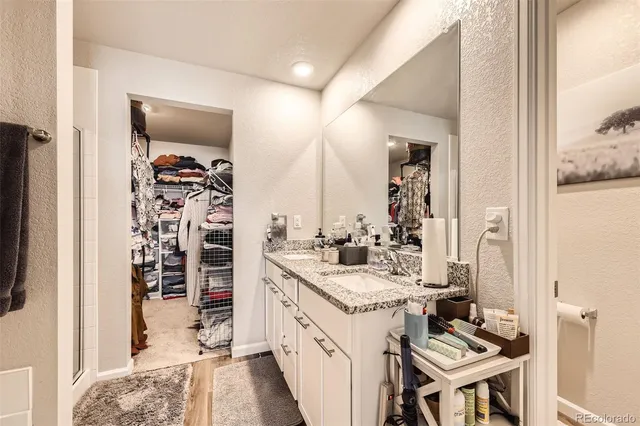 a bathroom with a double vanity sink and a mirror