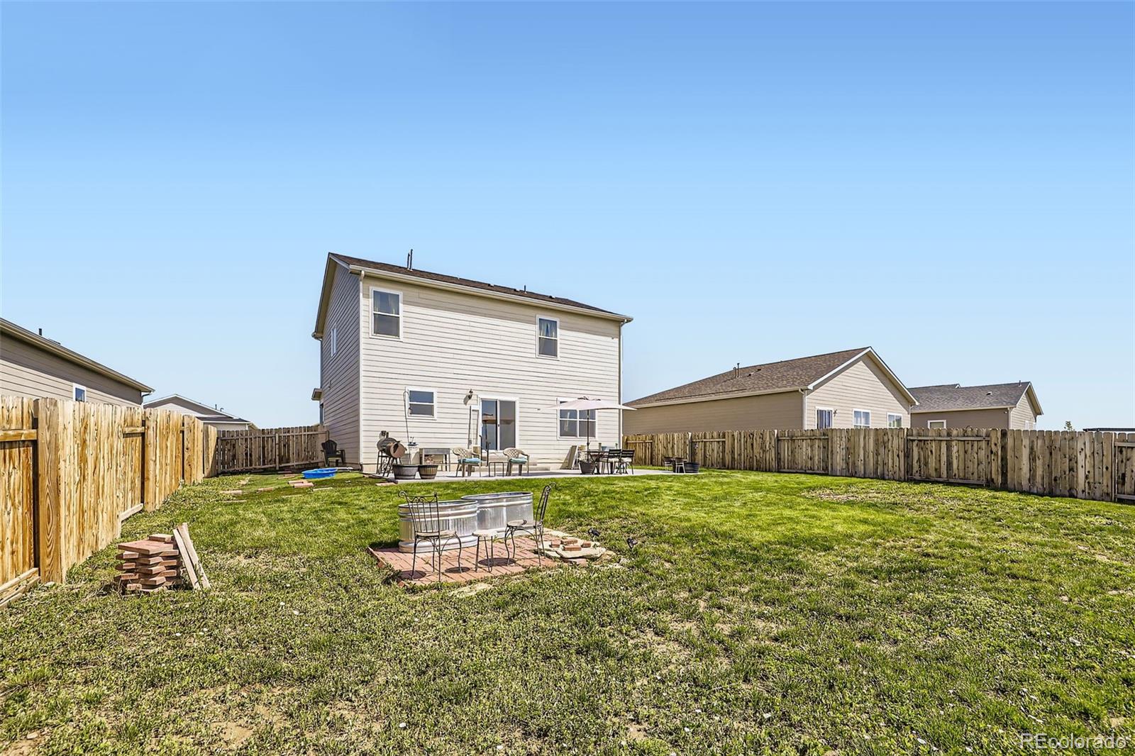1063 Gianna Avenue Fort Lupton, CO 80621 - Photo 18 of 20 a house view with a garden space