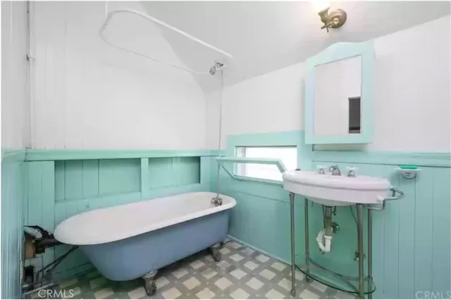 a bathroom with a sink and mirror