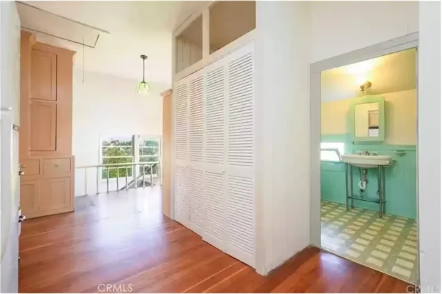 a view of a bathroom with tub and door
