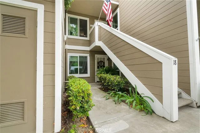 a living room with fireplace furniture and a flat screen tv